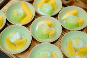 Mango sticky rice a famous Thai dessert. Ripe mango topped with coconut milk Sweet scent is a...