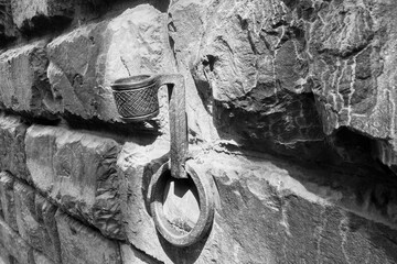 Vintage Iron Ring and Hook on Stone Wall - Black and White Photography for Historical Themes