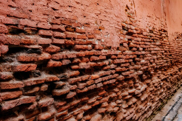 old damaged red brick wall