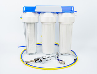 Set three of cartridges for water filter with clear glass of water. Concept of water treatment technology. filter cartridges to domestic water treatment systems.	
