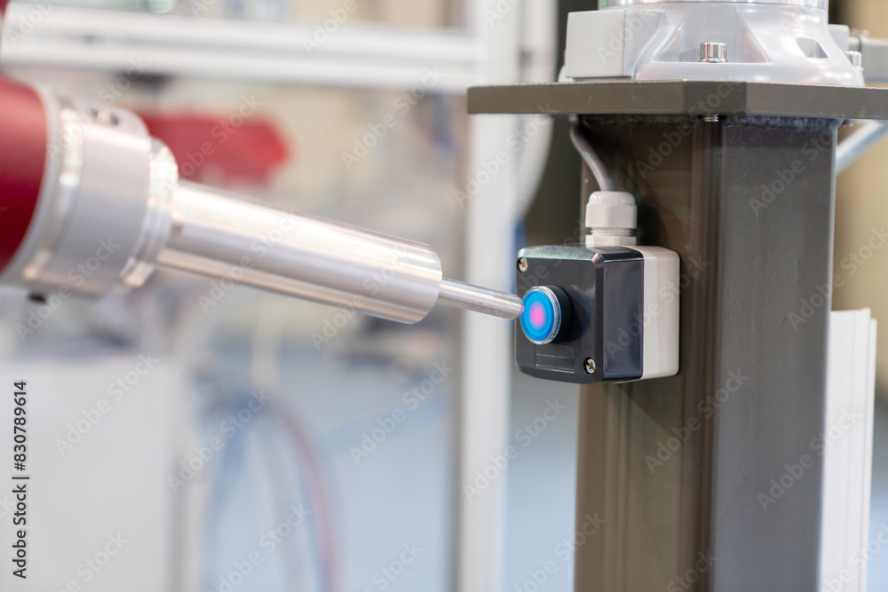 Aufkleber Industrial Robot presses the button. Accuracy calibration.