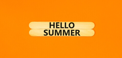 Hello summer symbol. Concept words Hello summer on beautiful wooden stick. Beautiful orange paper...