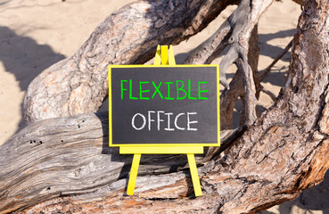 Flexible office symbol. Concept words Flexible office on beautiful yellow blackboard. Beautiful old tree sand background. Business Flexible office concept. Copy space.
