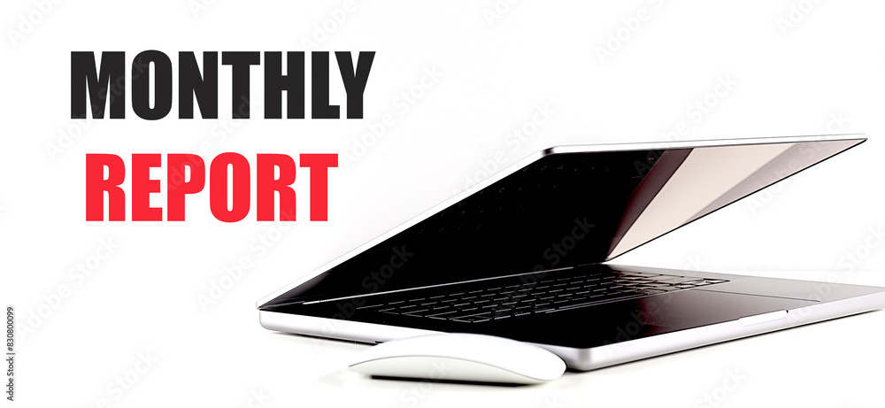 Poster monthly report text on white background with laptop and mouse