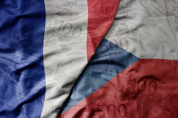 big waving realistic national colorful flag of czech republic and national flag of france on a euro...