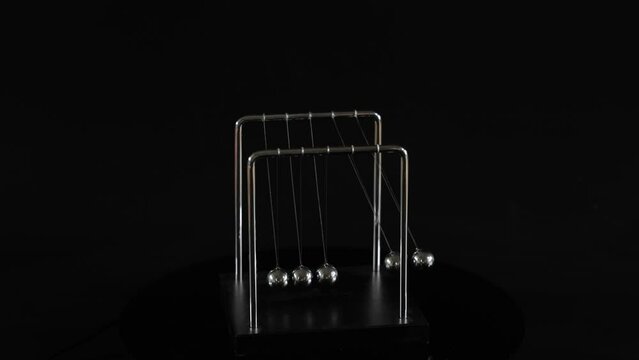 Newton's Cradle in Motion