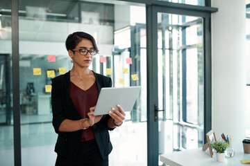 Businesswoman, office and tablet for browsing with glasses in corporate company for research with tech. Internet, online and stock market with accountant in modern firm for digital accounting.