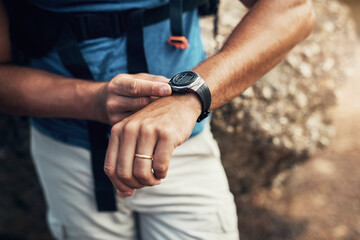 Arms, man and hiking watch in outdoors for fitness with health in mountain nature for exploration....