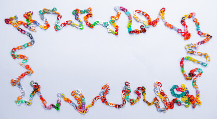 Vertical blue background with 90's curved retro plastic chain links with letters