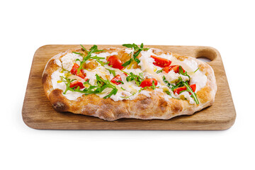 Fresh homemade flatbread pizza on wooden board