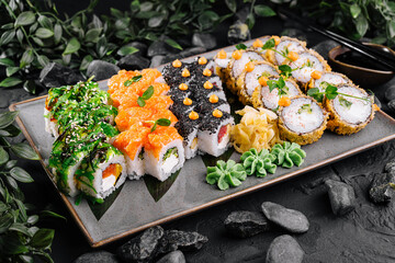 Assorted sushi platter on textured background