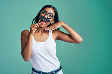 Woman, studio and mustache for happy portrait, excited and comic with humorous mask joke or comedy....