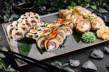 Gourmet sushi platter with sauces and garnishes