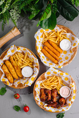 Assorted fast food platters on gray tabletop