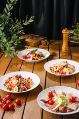Gourmet salad selection on wooden table