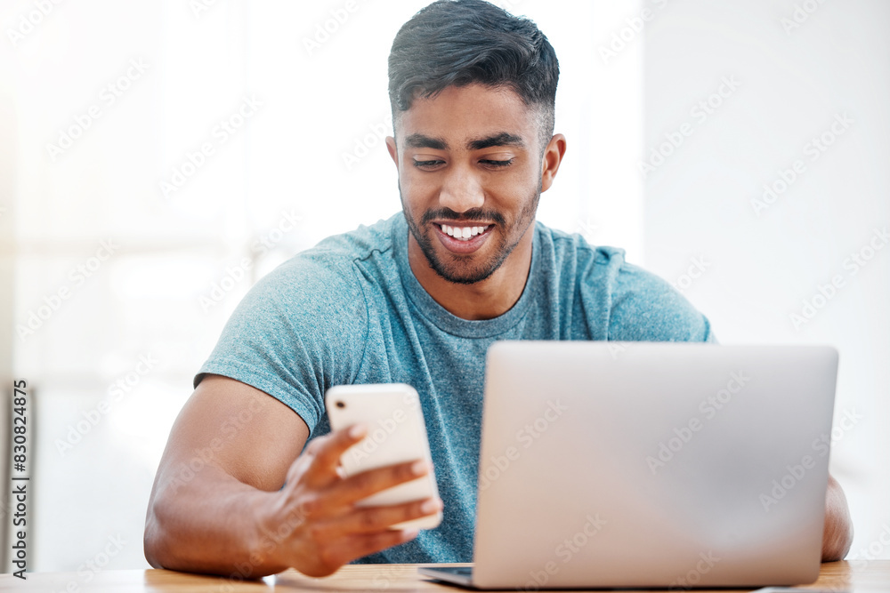 Aufkleber cellphone, social media and man in home with laptop and smile, ecommerce or technology for scrolling