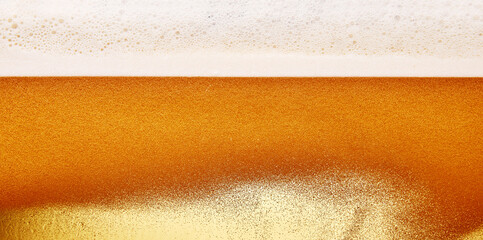 Textured photo of alcohol drink craft beer. Beer pale golden color with thick, creamy foam....