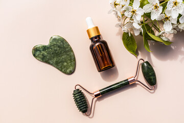 Massager, gua sha scraper , cosmetic massage oil in a bottle for home massage and facial skin care...