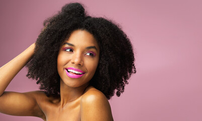 Girl, smile and hair care in studio with confidence for afro, hairstyle and trendy black person. Woman, happiness and salon on pink background for wellness, shampoo and texture with keratin treatment