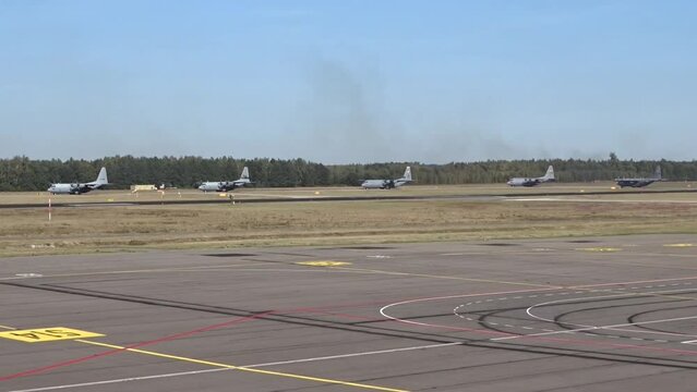 Military Airplanes Taxiing at Air Base