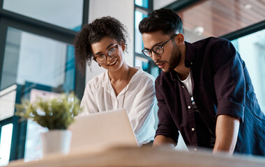 Office, laptop and colleagues with glasses, smile and together for collaboration of project online. Workplace, woman and man with teamwork, interior designer and digital for reading and business