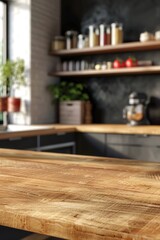 Wooden kitchen countertop with blurred background of shelves with jars and kitchenware.