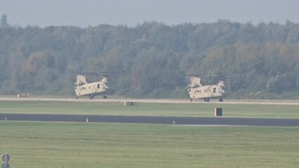Army Air Force Military Heavy Helicopters Landing at air base after mission.