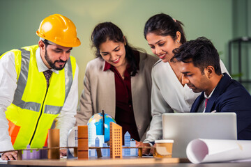 Indian asian Architect, builder and engineer in a team meeting discussing construction projects