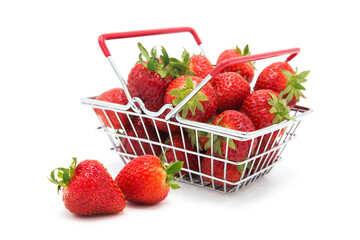 Shopping supermarket basket with fresh organic ripe strawberries whole and heap isolated on a white...