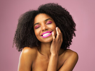 Smile, beauty and black woman with makeup in studio with cosmetics for skin isolated on background. Face, pink lips and application for cosmetology, attractive model and beautiful lipstick color