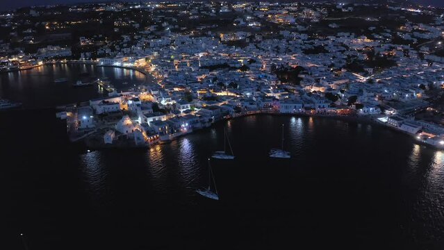 Aerial night view of Mykonos island harbor. Traditional greek architecture