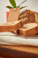 A marbled pudding on a board with a label for branding