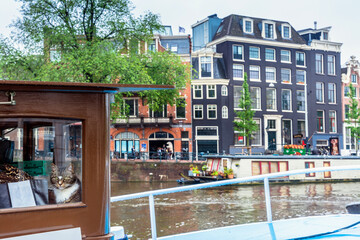 detail of cat on boat on Amstel river, Amsterdam, Netherlands