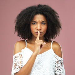 Anger, hush and portrait of afro black woman in studio on pink background for secret, silent or...