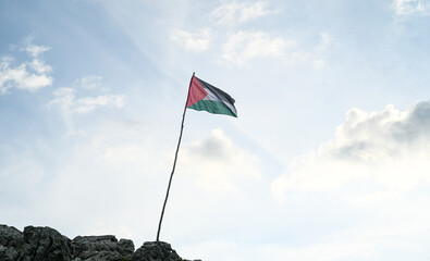 Fototapeta premium Flag of Palestine. Palestinian flag on the flagpole on the top of the hill.
