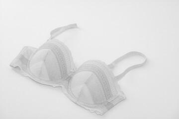 Closeup of white lace bra