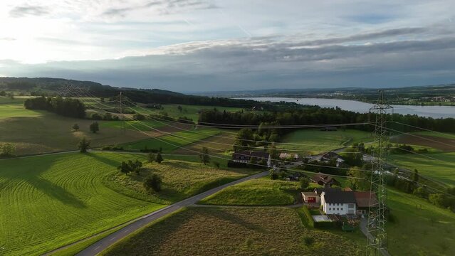 The serene greifensee in switzerland with lush green fields and a calm lake, aerial view