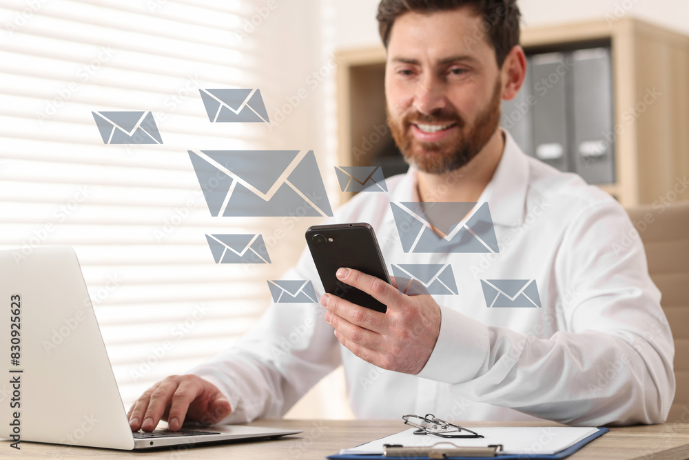 Poster smiling man with smartphone chatting at table in office. many illustrations of envelope as incoming 