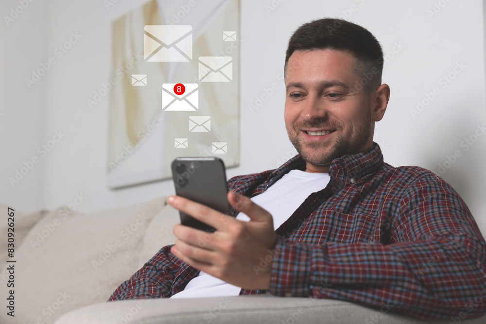 Poster smiling man with smartphone chatting indoors. many illustrations of envelope as incoming messages ov