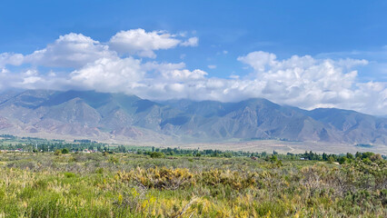 A picturesque mountain summer landscape. A mountain range against a clear blue sky. A journey...