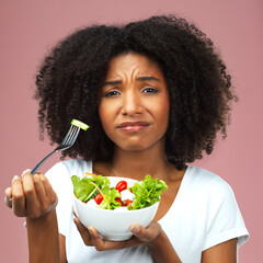 Health, salad and portrait of black woman in studio eating vegetables for nutrition or vegan diet....