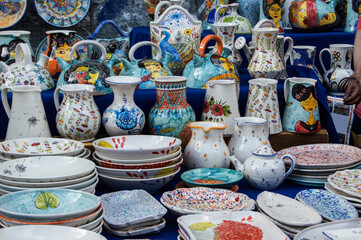 different painted and decorated ceramic objects in a street market