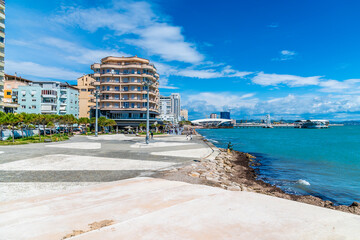 A view down the promenade towards the beach side buildings at Durres, Albania in summertime