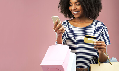Phone, credit card or happy girl with shopping bag in studio for sale, discount or retail offer promo on pink background. Ecommerce, deal and gen z customer with smartphone, sign up or app payment