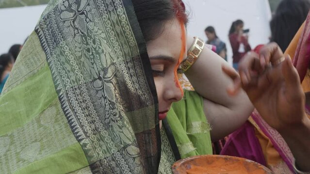 indian Married Hindu women attending vermilion holy rituals at chhath festival at morning