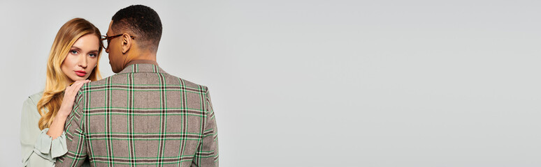 A man and woman lock eyes in a moment of connection and intimacy.