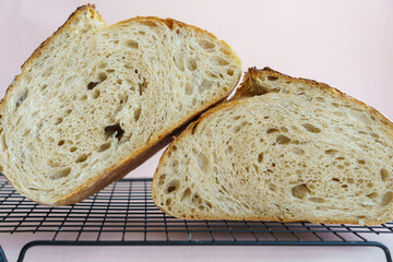 classic artisan tartine bread in cross section, showing the airy crumb.