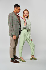 Man and woman exude love while striking a pose.