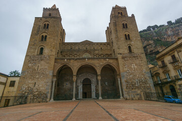 Fototapeta premium Facade of Cathedral Duomo di Cefalu on cloudy rainy day, Cefalu, Sicily, Italy.