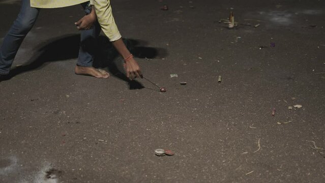 bomb fireworks burning by kid during the Diwali festival celebration at night